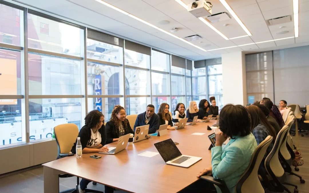 Professionals using essential English phrases during a business meeting.